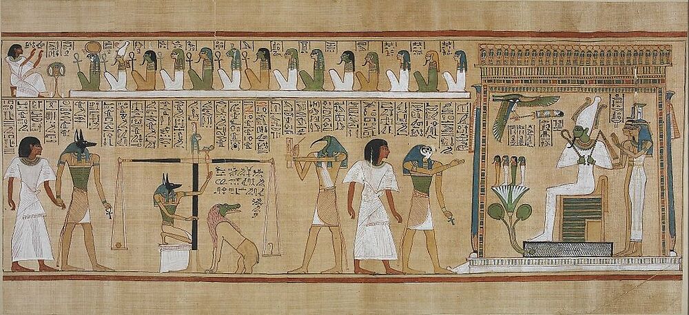 To the left, Anubis brings Hunefer into the judgement area. Anubis is also shown supervizing the judgement scales. Hunefer’s heart, represented as a pot, is being weighed against a feather, the symbol of Maat, the established order of things, in this context meaning ‘what is right’.