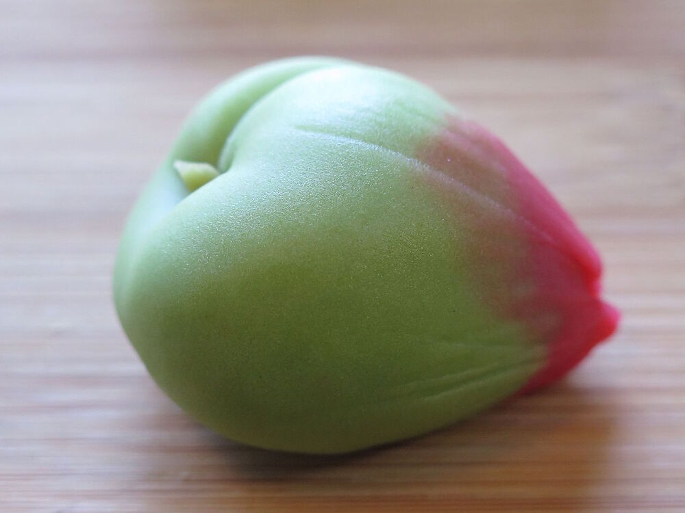 Wagashi, 和菓子, a kind of Japanese sweet commonly served at a traditional tea ceremony. This is depicting a ground cherry.
