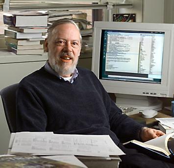 Dennis Ritchie at his desk, with an acme session