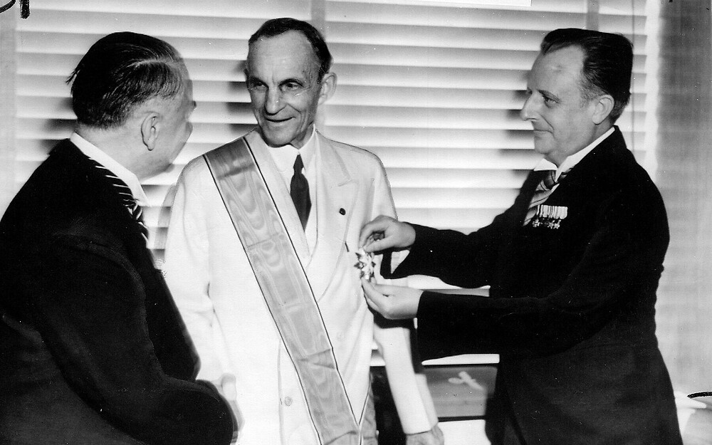 Henry Ford (center) receives the Grand Cross of the German Eagle, Germany’s highest decoration for foreigners, in July 1938